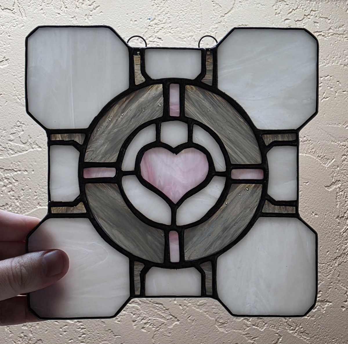 PrismtreeStudio's tweet photo. For science! Someone needed a companion, so they ordered this #portal #Stainedglass #suncatcher . Remember the companion cube cannot speak, but nether will it stab you in the back. 

#glass #art https://t.co/Ah0pLDznLs