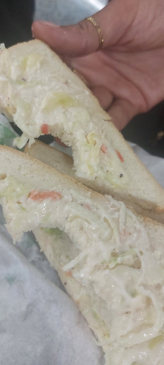GordonDimmack's tweet photo. They’ve just handed out another sandwich. It's disgusting.

Some sort of cabbage and mayonnaise debacle.

I don't know how they think this is acceptable. https://t.co/RW1CTytqzo