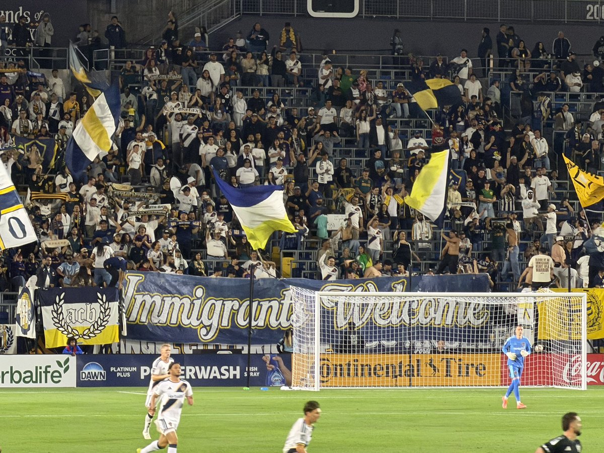 “Immigrants Welcome” banner being proudly shown in Victoria Block. #LAGalaxy