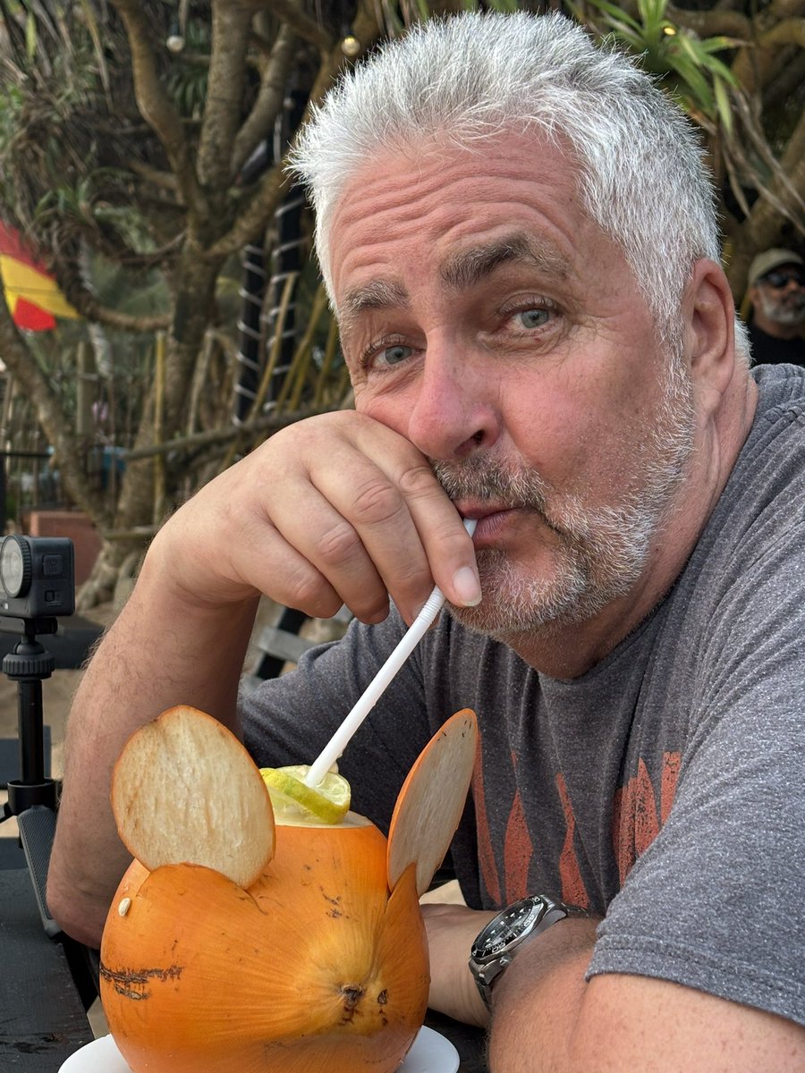 Diane giving it large with a Pina Colada.  Me, I’m going all tough lad with a cup of green tea and a coconut. #srilanka.
