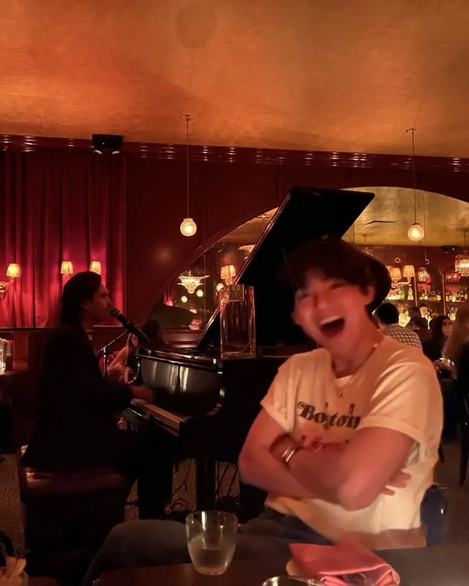 Soft amber glows, a quiet baby grand humming beneath my fingers, and a voice spilling through the air like silk in the dark.
I smiled a bit too wide, sipped on something that burned a little sweeter than it should, and let the night sink into me more than I meant to.