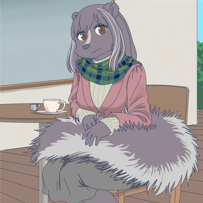 ひざ掛け代わりにするスカンク