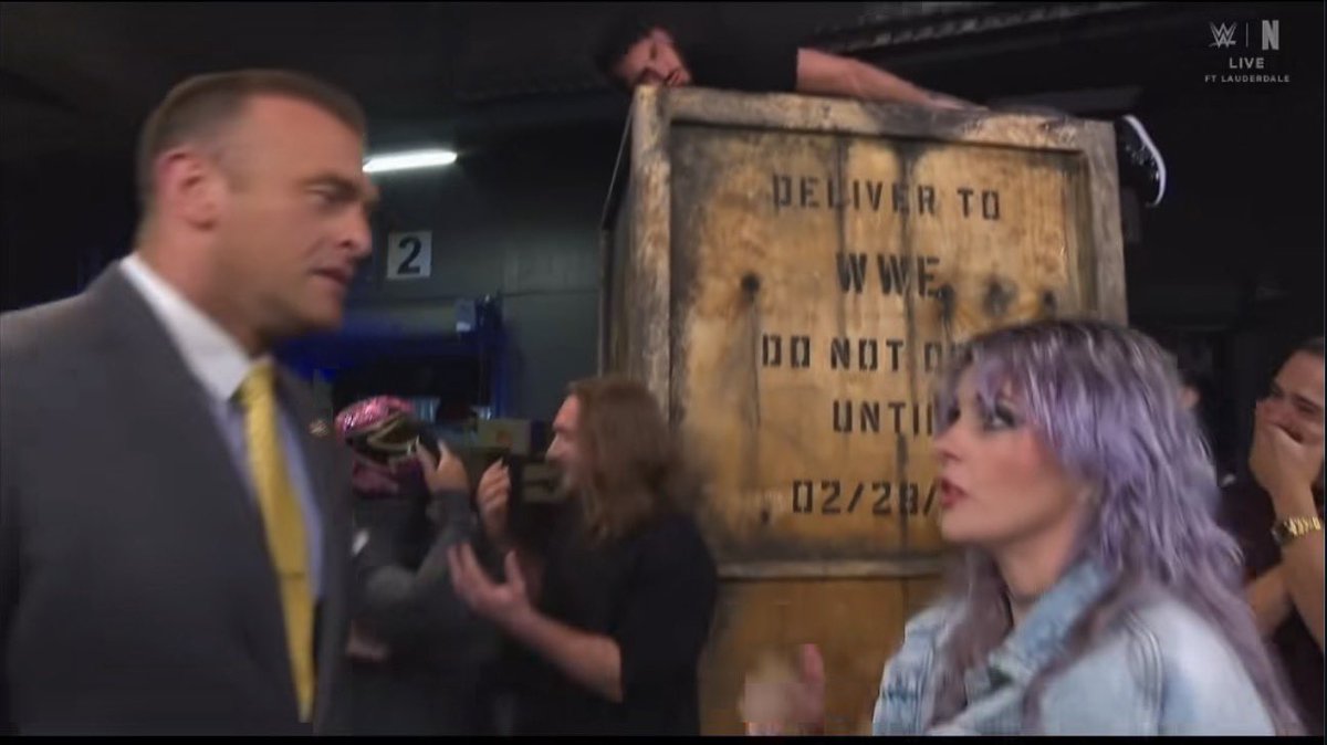 PatrickLenihan2's tweet photo. WWE sort of hinted at it being Danhausen when you look at who was surrounding the crate here. Being a mid carder I mean. https://t.co/8a7wFMOUuu