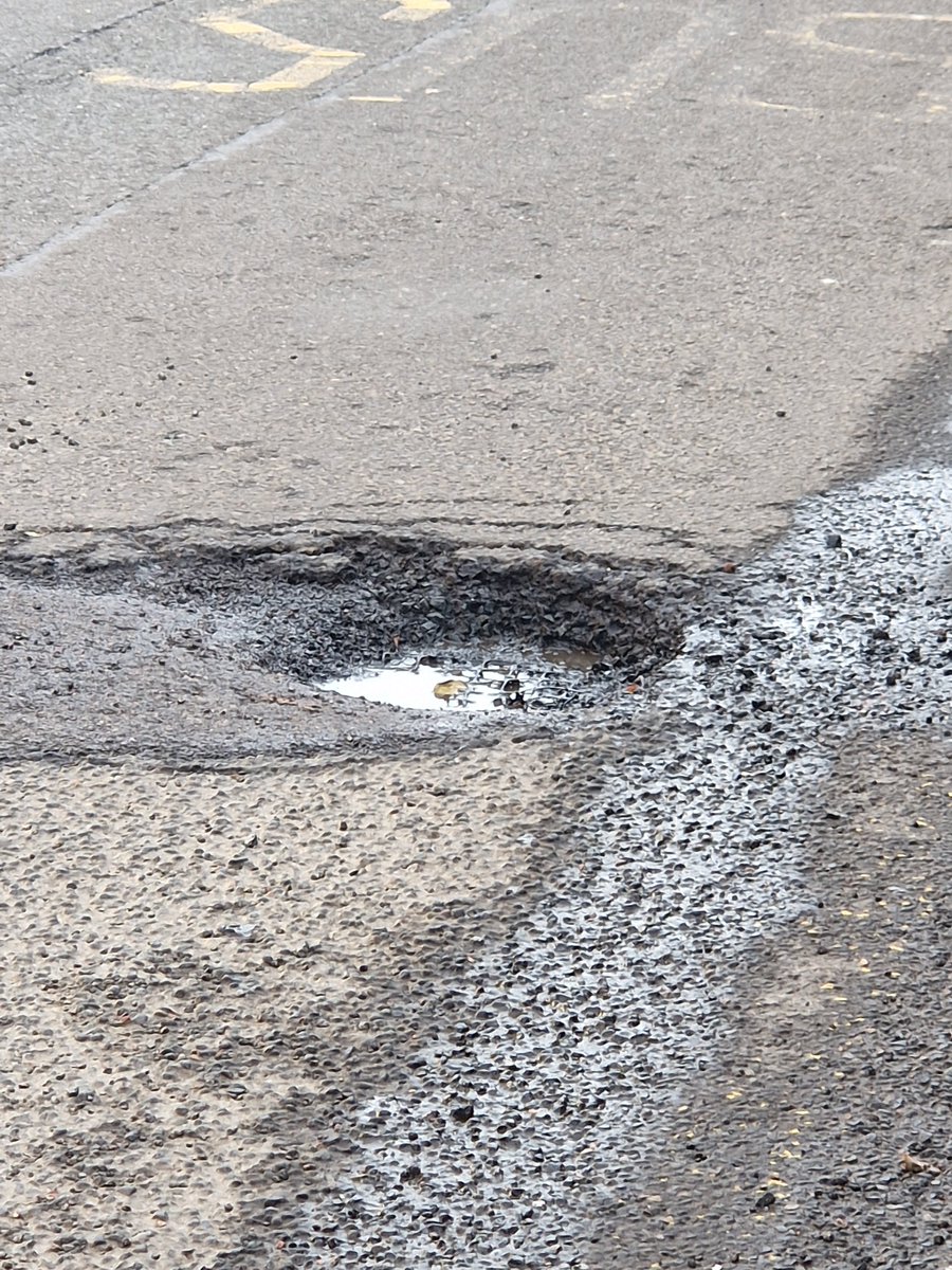 CakeMonster76's tweet photo. @edinhelp deep pothole repair failure at the bus stop on Morningside Road at the junction with Morningside Place/outside the medical centre. https://t.co/4DN3V0RC2n