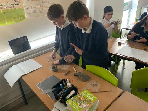 LAParnwell's tweet photo. This half term Y6 are diving into Holes! 📘
For their experience day, they designed their own animals and created them from clay. Next, they wrote a non‑chronological report based on their creations. What creativity! 🌟🧡#ParnwellPrimary #ParnwellLearning #CreativeCurriculum https://t.co/qnxL8udbDz