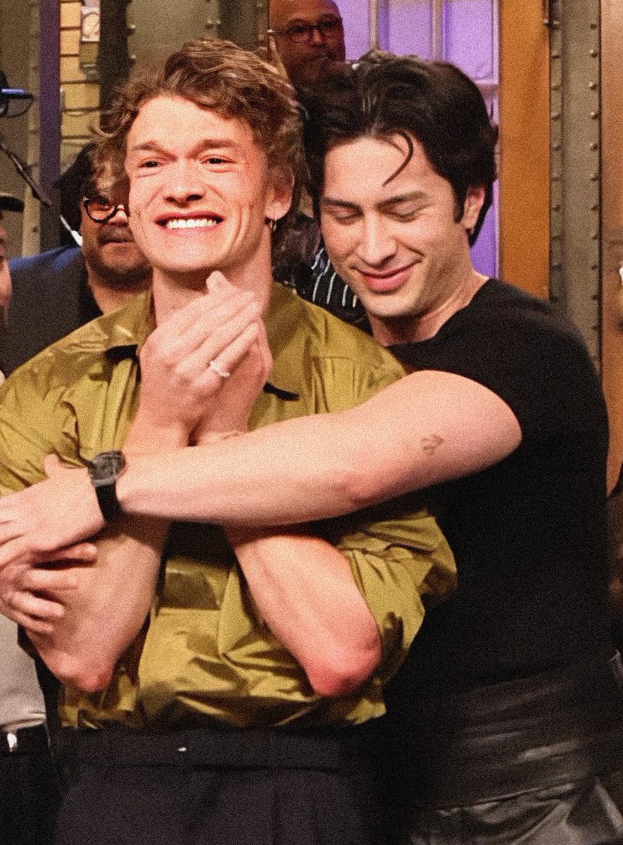 BuzzingPop's tweet image. Hudson Williams comforting an emotional Connor Storrie during #SNL end credits.