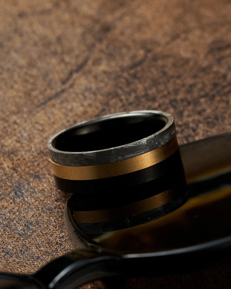 TheRingShop's tweet photo. Atlas is comprised of authentic Muonionalusta meteorite and gold/black ion-plated tungsten carbide. This combines the rarity of meteorite with the durability of tungsten carbide, creating a design which is quite literally out of this world 💍

Add to your cart today! https://t.co/gLXwMDHGY6