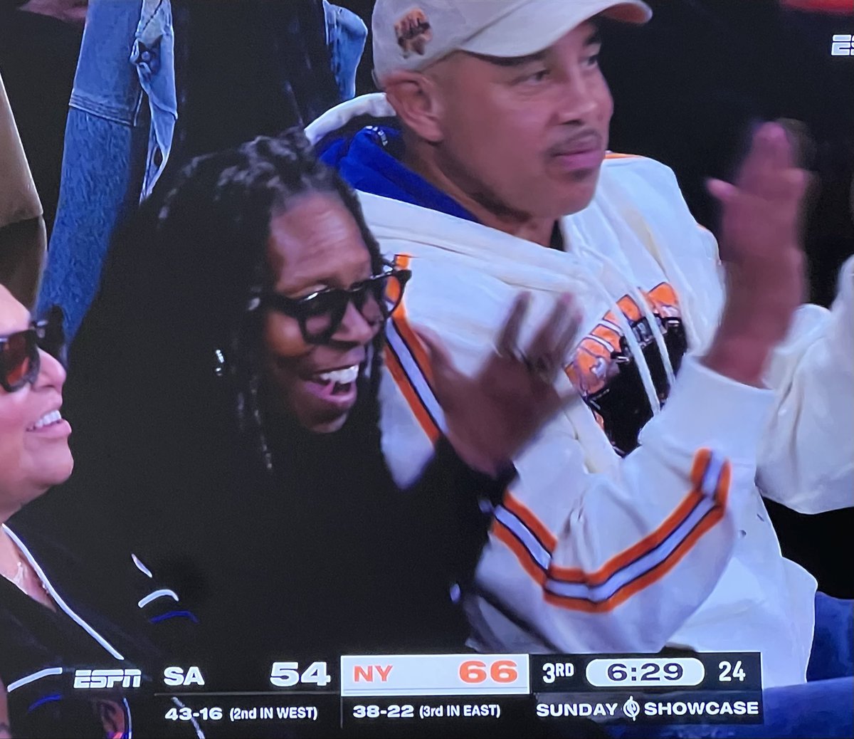 Former Knicks coach Eddie Franklin sits next to John Starks at the game