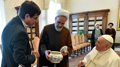 robinmonotti's tweet photo. They want you to believe that Iranian clerics are some Christian hating barbarians. Quite the opposite. This is Ayatollah Arafi, cleric, jurist &amp; philosopher, presenting a gift to Pope Francis at the Vatican in 2022. 

(File Photo: Vatican Media via Reuters) https://t.co/5R2Zrpk9ZQ