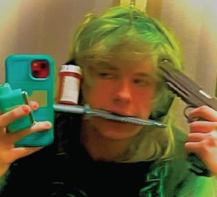 Another photo transgender Phillip posted appears to show him with a gun and a bottle of pills

He was just indicted for threatening to kiII Trump

Is that hormone drugs??

What’s in these drugs??