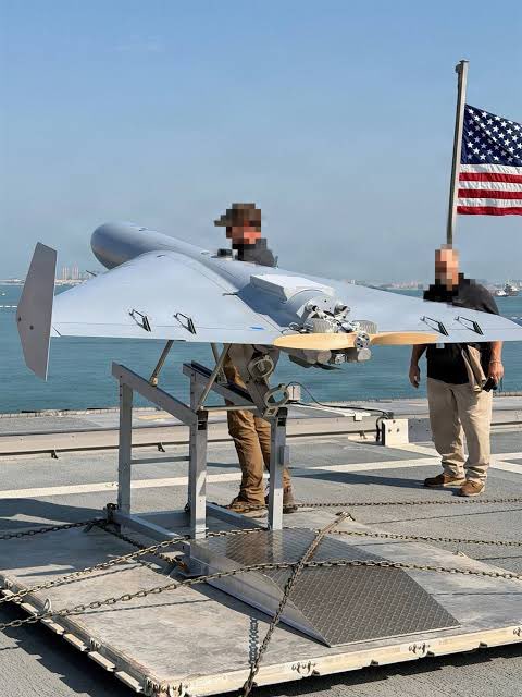 shanaka86's tweet photo. On July 16, 2025, Secretary of Defense Pete Hegseth held up a drone at a Pentagon event. It had a delta wing, a pusher propeller, and a silhouette that anyone who had watched the war in Ukraine would recognize immediately. It was a copy of the Iranian Shahed-136, the kamikaze drone that Russia had fired by the thousands into Ukrainian cities, the weapon Iran distributed to Houthi proxies in Yemen, the airframe that humiliated Western air defense systems through sheer volume and cheapness. Except this one was American. Built by an Arizona startup called SpektreWorks from a captured Iranian airframe.

Seven months later, on February 28, 2026, CENTCOM confirmed that the Low-cost Unmanned Combat Attack System flew in combat for the first time during Operation Epic Fury. Against Iran. The country that designed the original.

CENTCOM’s statement was direct: “Task Force Scorpion Strike, for the first time in history, is using one-way attack drones in combat during Operation Epic Fury. These low-cost drones, modeled after Iran’s Shahed drones, are now delivering American-made retribution.” Task Force Scorpion Strike was established in December 2025 with an explicit mandate. A US official told The War Zone the unit was created “to flip the script on Iran.” On December 16, a LUCAS drone was test-launched from the Littoral Combat Ship USS Santa Barbara in the Persian Gulf. Ten weeks later, the script was flipped.

Here is the economics. A Tomahawk cruise missile costs approximately $2 million. LUCAS costs $35,000. For the price of a single Tomahawk, you can launch 57 LUCAS drones. A Shahed-136 in Russian production costs approximately $80,000 per unit at the Alabuga facility. The American reverse-engineered version costs less than half the Russian licensed copy of the Iranian original. SpektreWorks received a $30 million initial production contract. That buys 857 kamikaze drones for what the Navy spends maintaining a handful of Tomahawks.

But cost is not the real story. The original Shahed-136 navigates by pre-programmed GPS and inertial guidance. It flies to a fixed coordinate and detonates. It cannot be retargeted in flight. It cannot communicate with other drones. It cannot adapt. LUCAS integrates with the MUSIC mesh network, a multi-domain unmanned systems communications architecture that allows each drone to function simultaneously as a strike weapon and a communications relay node. Some units carry Starlink terminals, specifically the military Starshield variant, enabling beyond-line-of-sight satellite communications, real-time human oversight, and autonomous swarm coordination in GPS-denied and electronically jammed environments. The original Shahed is a flying bomb with a coordinate. The American version is a networked intelligence node that happens to explode.

Russian military commentators are already sounding alarms. The integration of Starlink with a mass-producible airframe represents a threat class that existing electronic warfare cannot reliably counter. You cannot jam a mesh network the same way you jam a GPS receiver. The drone that does not reach its target still relays targeting data for the drone behind it. Every unit the enemy shoots down costs the defender more in interceptor ammunition than the attacker spent building it. That is the Shahed math, the logic Iran invented and Russia perfected in Ukraine. The United States just applied it to the country that wrote the equation.

Seven months from Pentagon debut to combat deployment. For context, a traditional major defense acquisition program takes seven years to reach Milestone B. Iran spent a decade refining the Shahed-136. 

The United States reverse-engineered it, improved it, networked it, and sent it home in under a year.

https://t.co/BrzGRrU3VW