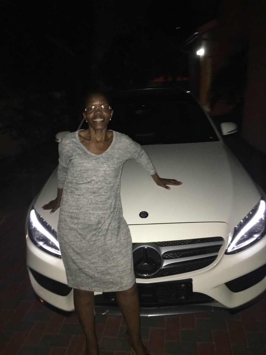 Mom sitting on my first car…