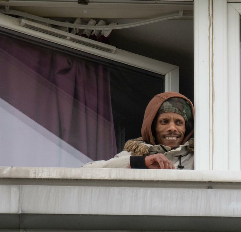 The stabber is seen here looking out the window of his free housing just laughing at Scotland.