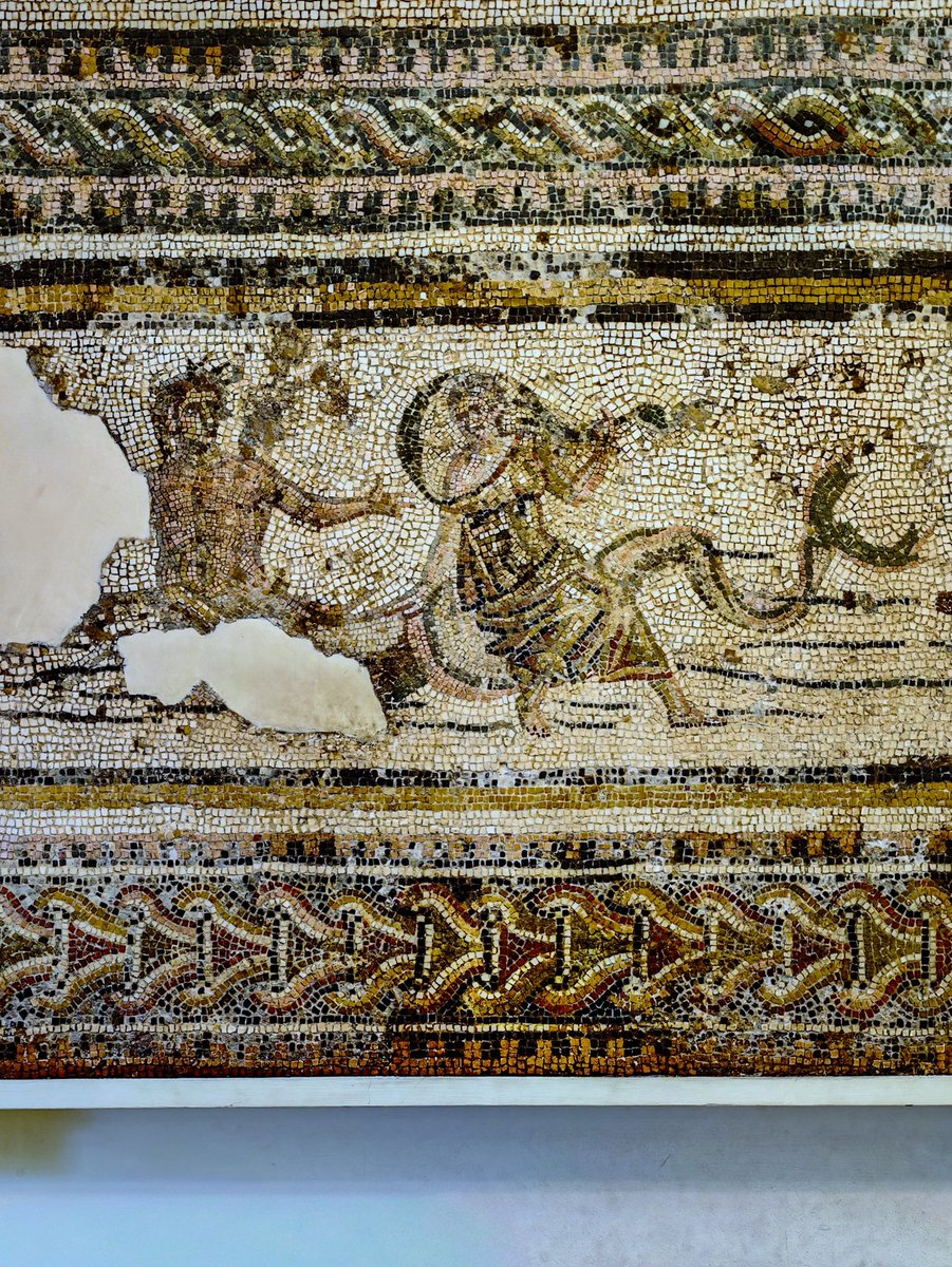 antmoose's tweet image. This #MosaicMonday we're at the #BritishMuseum to see a #mosaic from #Roman #Carthage, c. 150 CE, where the usual flirtation between a #triton and a #Nereid doesn't seem to be going well, but the complex #frame takes equal attention: #guilloches, #braids, #dentils. Fancy.