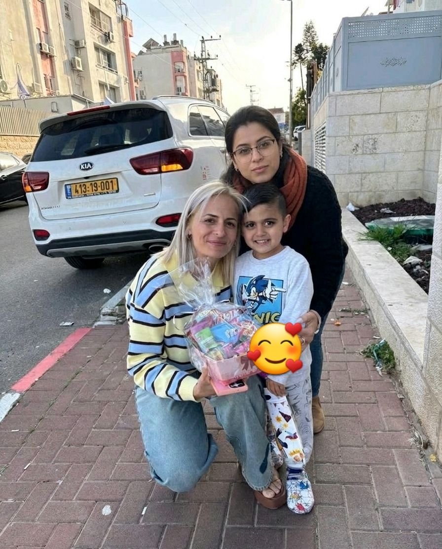 sabababka's tweet photo. The situation in Tel Aviv is so dire...

She has just one black top and orange scarf left!
And an identical facial expression, all 2 months apart! https://t.co/So4rXDRwym