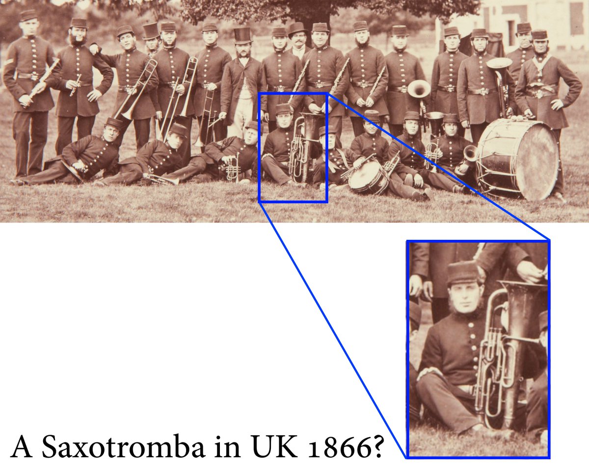 SaxRevolutions's tweet photo. Photograph of a brass band with flutes, trombones, trumpets, French horns, and drums, standing in the grounds of Sandringham House (1866). The centrally placed instrument would be a saxotromba? 🤨 https://t.co/yWCssh7xIo