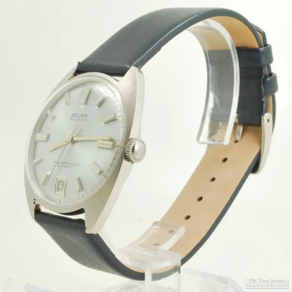 PMTimeService's tweet photo. A #vintage Belair wrist watch from the 1960s, with a 25-jewel grade PUW1381 automatic movement, silver-toned metal dial with a sunburst brushed finish &amp; date aperture at 6 o'clock, in a stainless steel cushion-shaped thin-model water-resistant case:
https://t.co/E4ORmvSETs https://t.co/wlFzqPoiyo