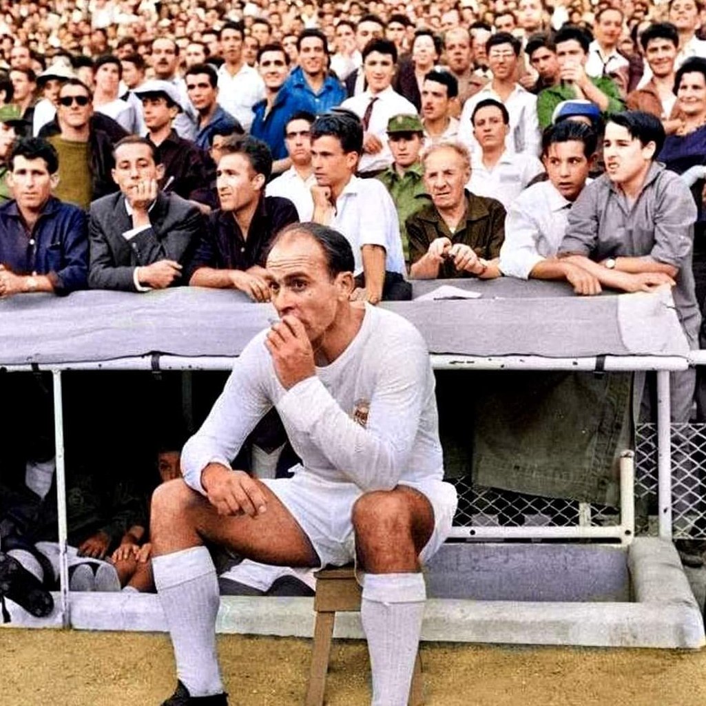 Alfredo Di Stefano smoking a cigarette on Real Madrid's bench in 1964.