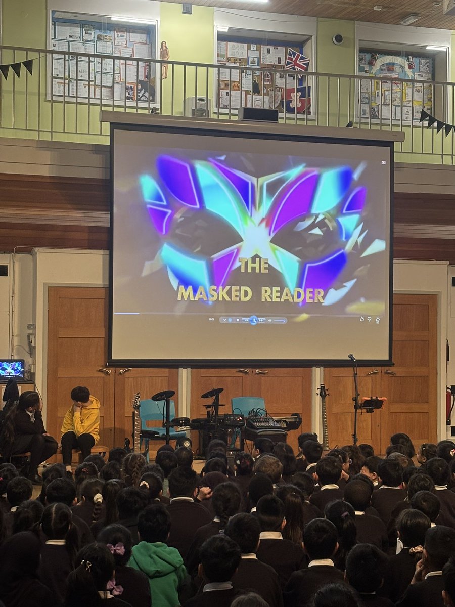 MarshfieldPS's tweet photo. The Masked Reader Competition π Who do you think is behind the mask? Marshfield staff reading their favourite book but who could it be ? All will be revealed this Friday! ππ€·ββοΈ#WorldBookDay2026 #MPSReading @Victoria_HARTF https://t.co/jW261w12hF