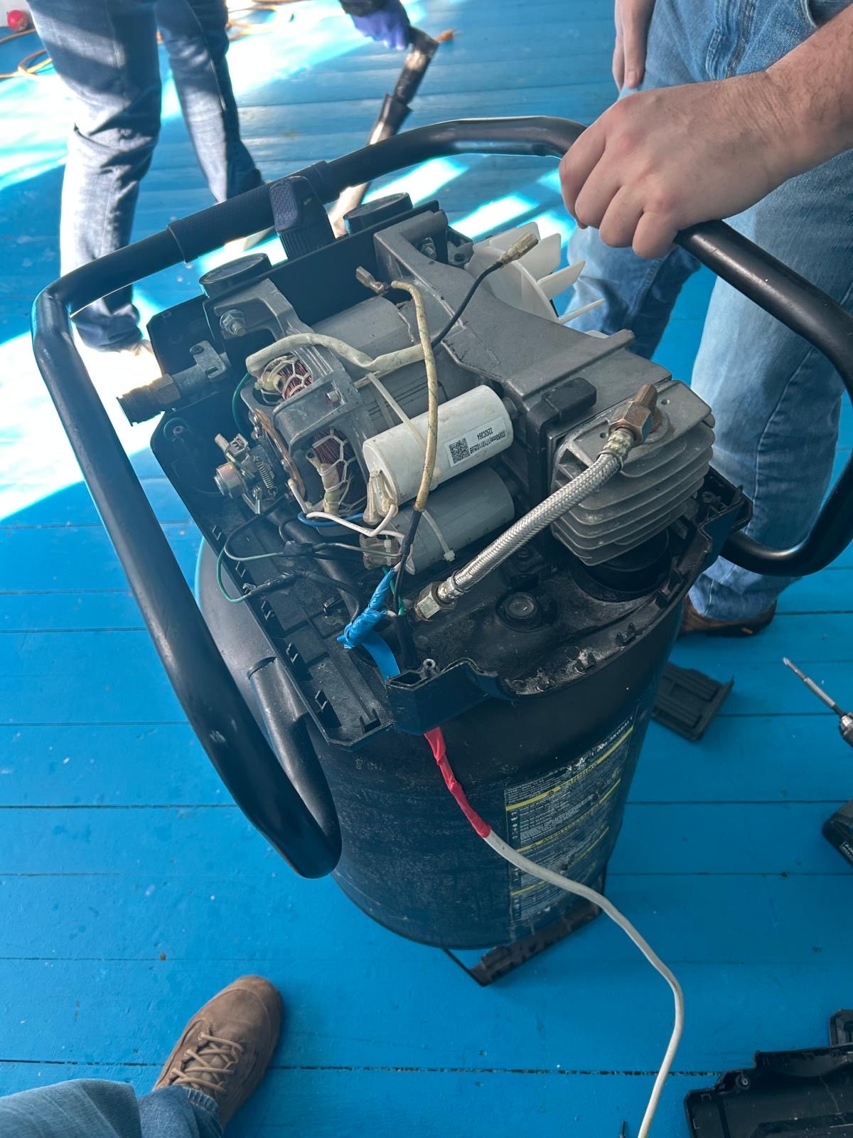 Disassembled air compressor showing concealment compartment