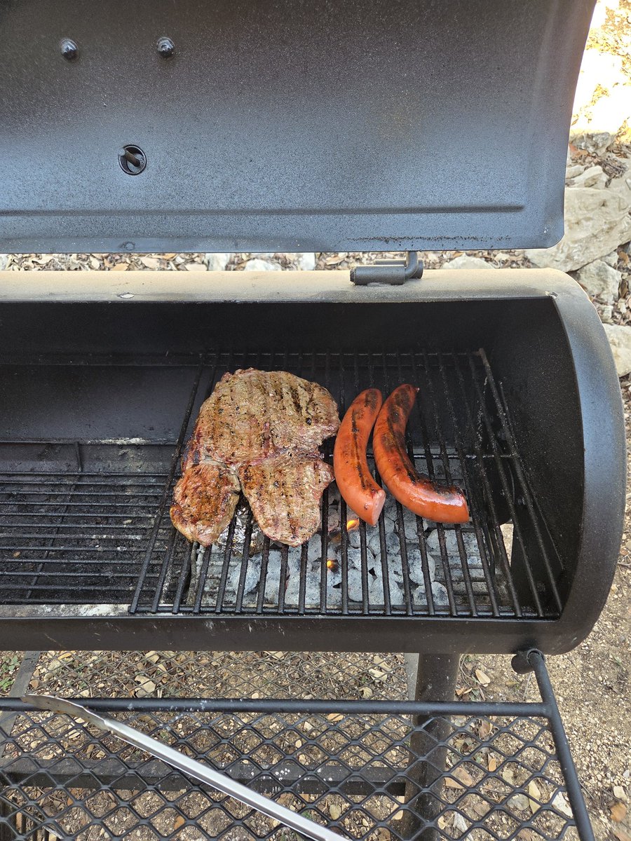 Good afternoon grilling a sirloin steak and sausage and onion,  homemade salsa