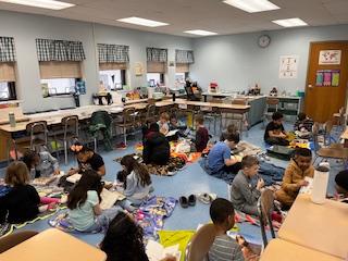 DinaFouser's tweet photo. Mrs. Graham’s third graders are kicking off Read Across America Week and MARCH into Reading the best way we know how — with a 📚✨ reading picnic! 

Blankets down, books open, and imaginations soaring. Let the reading adventures begin! #ReadAcrossAmerica @HomevilleEleme1 https://t.co/IGeAKjdU3Y