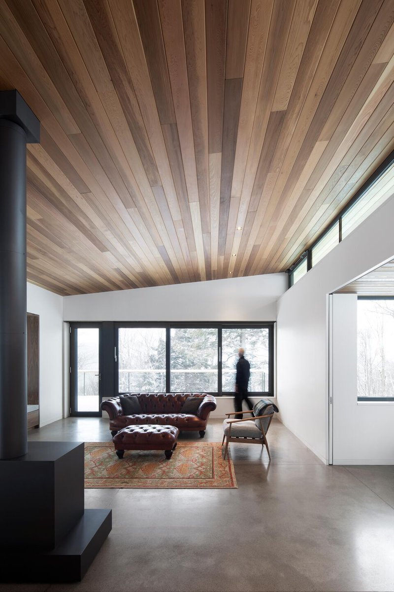 Archello's tweet photo. RobitailleCurtis, Inc. situates Laurentian Forest House within the hillside, using a high-performance envelope with R-63 roof and R-47 walls, triple glazing, and minimized thermal bridging.
https://t.co/MuoR1ScdHg
#HighPerformanceEnvelope #PassiveDesign #WoodAndConcrete https://t.co/bSP0OtrNiI