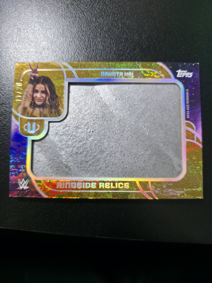 <a href="/Topps/">Topps</a> <a href="/WWE/">WWE</a> I got this ringside relics card but I think whatever was to be in it is missing. Because there isnt any kind of fabric in that. Its hard. Is the fabric missing? Or what is this?
