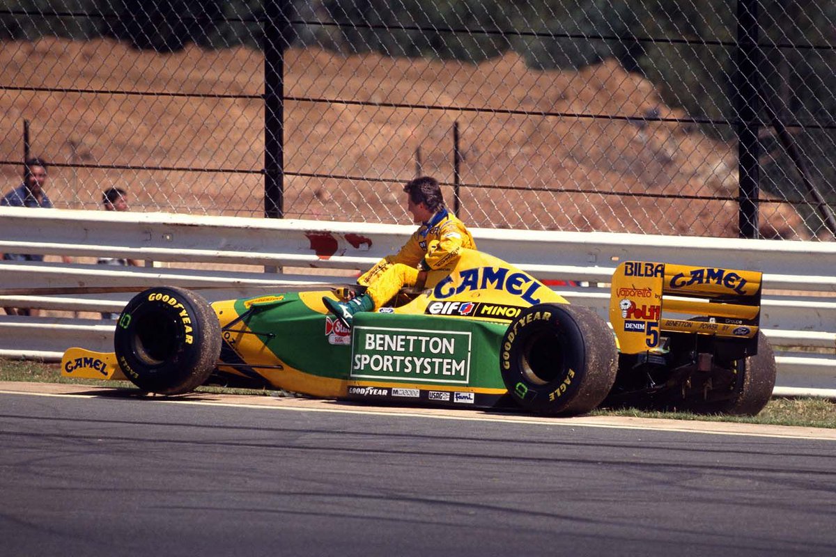 UnracedF1's tweet photo. Schumi casually chilling on his Benetton B193A after he spun during the South African Race at Kyalami in 1993. #F1 #RetroF1 https://t.co/QwkVxj1wQT