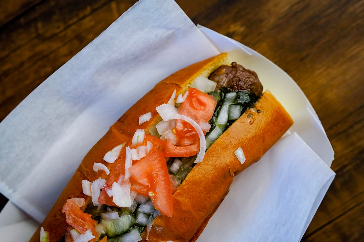 Taste a bestseller at Haute Dogs! 🌭🔝 Enjoy our Lamb Sausage, locally sourced and topped with mint sauce, tomato, and chopped onion. Every bite is a flavor adventure! 😋 

#HauteDogs #LambSausage #nofarmsnofood #shoplocal #eatlocal