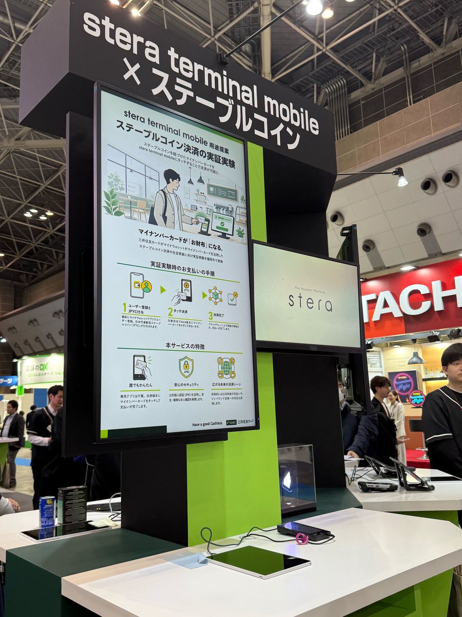 7pastelblackcat's tweet photo. 本日から開催されている「リテールテックJAPAN 2026」の SMCC 様のコーナーで「stera terminal mobile」でのステーブルコイン決済事例紹介ブースが設置されています！先日行われた福岡市でのマイナンバーカードタッチによる JPYC 決済実証の様子や、担当の方のカードで実際に決済するデモも見ることができます！ぜひ足を運んでください！