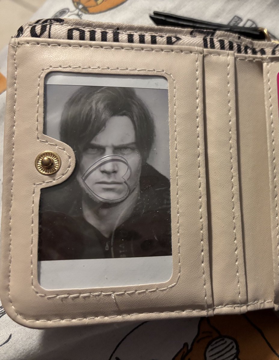strawshua's tweet photo. putting him in my wallet because i don’t play about Leon Kennedy https://t.co/cTLHOAqXkc