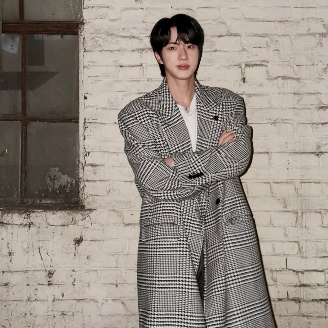 JIN looks like a mysteriously dreamy prince straight out of a classic novel in new photos.