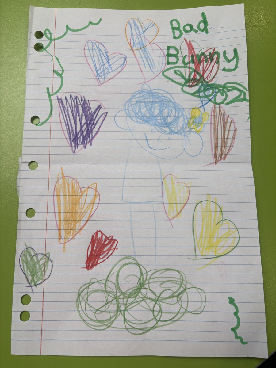 RedheadEdition's tweet photo. This is apparently @sanbenito standing on his money and full of love. Brought to you by Grade 1. With a flower in his hair. It’s perfect. #BadBunny https://t.co/smsEG6GARe