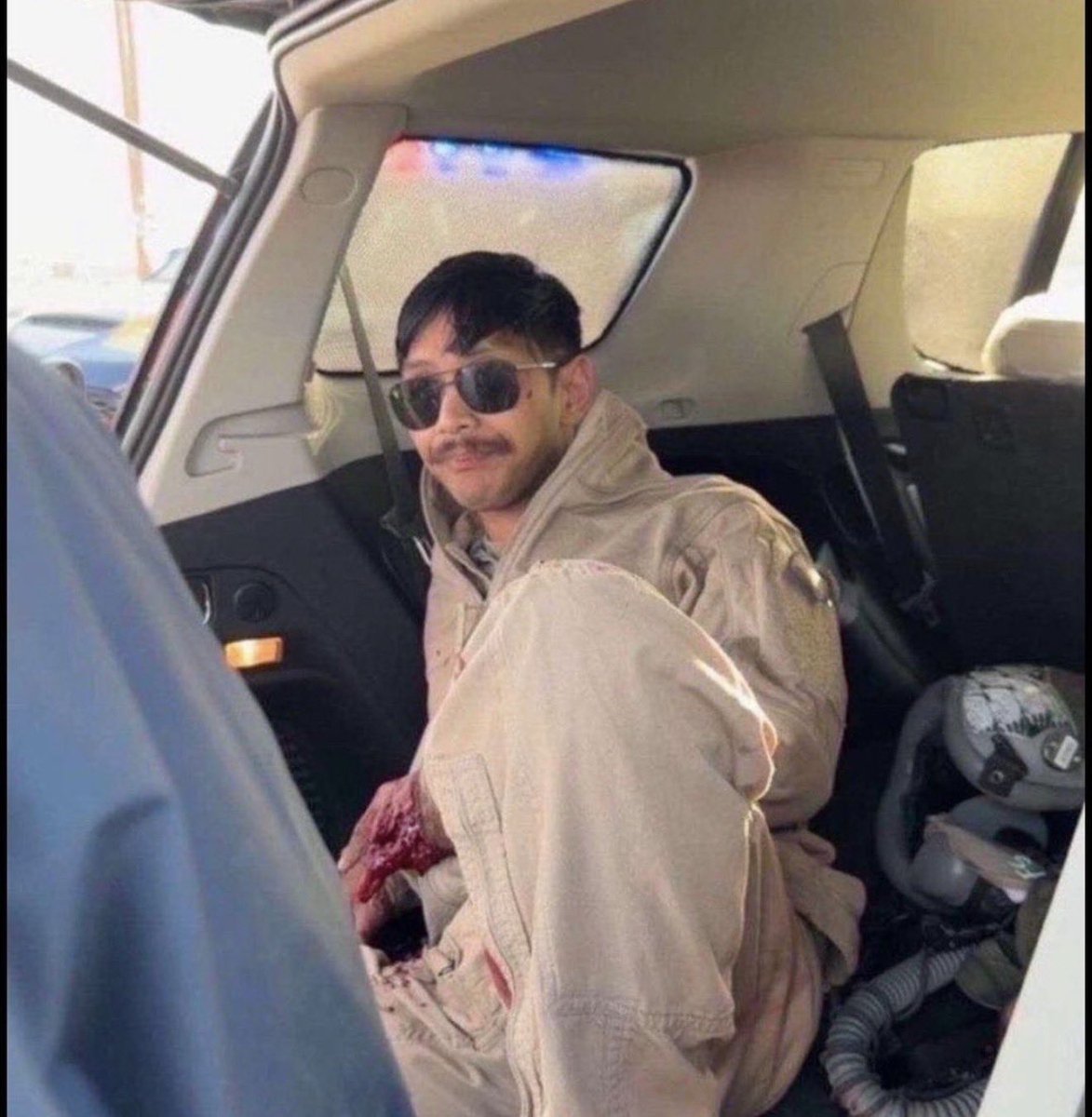Icymtweet's tweet photo. The American pilot shot down hours ago is chilling with the Kuwaiti guys who found him, enjoying a cup of tea.
Looks like his hand might be badly injured, though. https://t.co/SKqjMGB86h