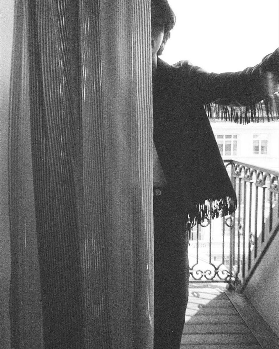 I wasn’t trying to be seen — I was simply there. Suspended in the quiet space between darkness and glow, where one side of me melts into the shade and the other softly catches the light.