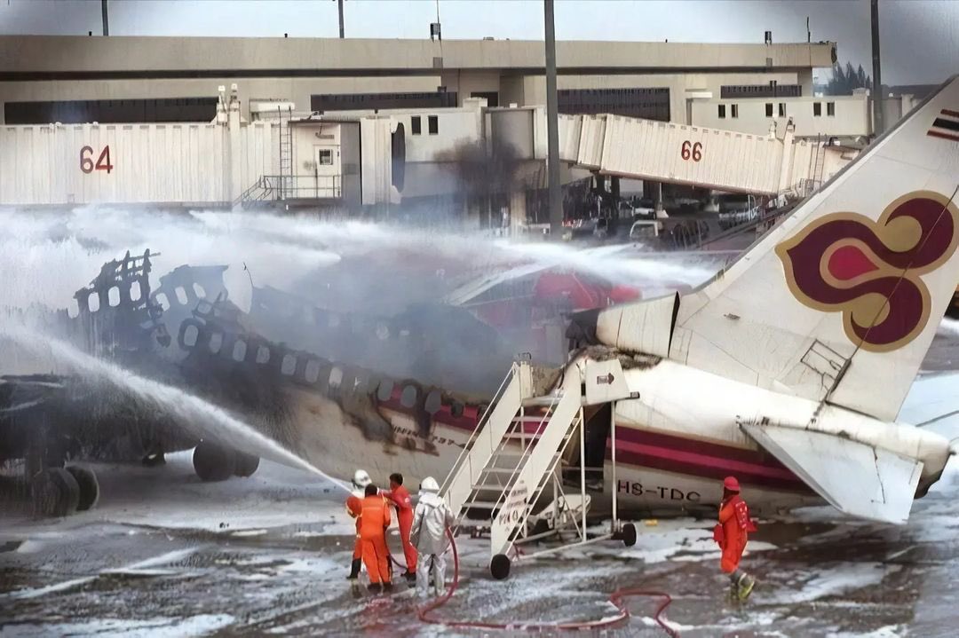 25YearsAgoLive's tweet photo. Thai Airways International Flight 114, a Boeing 737, explodes at the gate in Bangkok due to a fuel tank malfunction. 

One crew member, a flight attendant, is killed. https://t.co/89ip8O4kPw