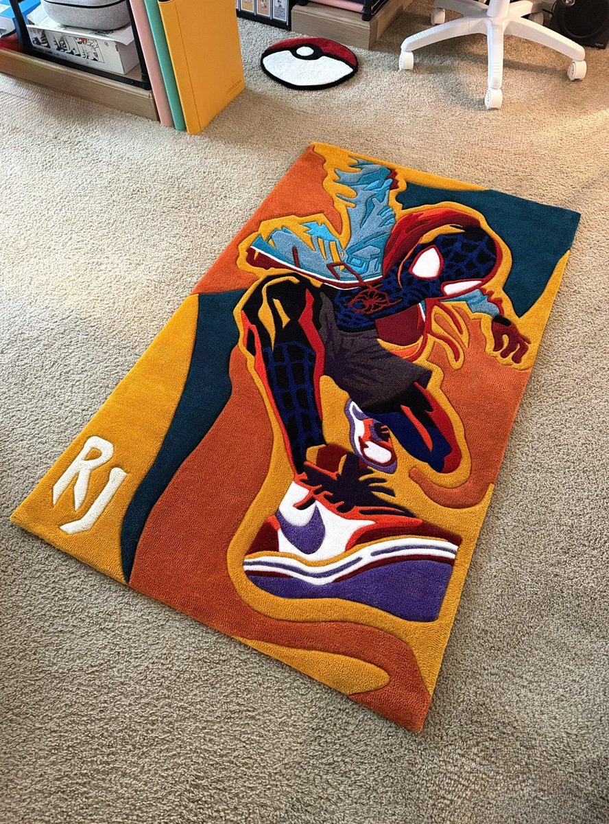 YALL LOOK WHAT I MADE!!!!!! 5 x 3 feet. My client gave me an assessment— “Miles Morales vibe Spider-Man, bright colors, with ‘RJ’ initials in corner” that’s it… so I drew up and tufted this badass piece they can now love forever!!! 🥹🔥🥰🕸️🕷️❤️‍🔥 #customart #sk_rugz #textileart