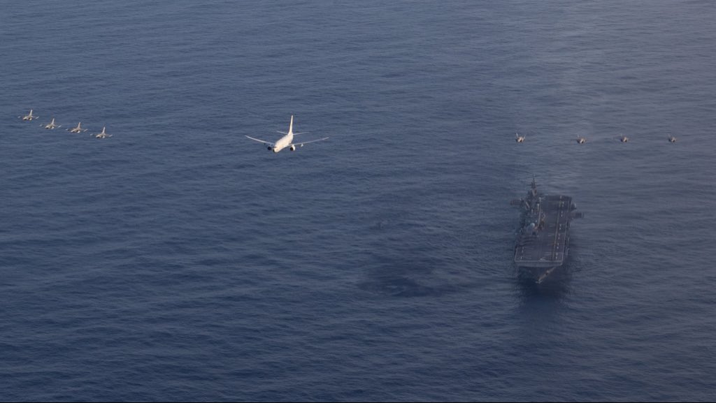 31stMeu's tweet photo. USMC 🦅 USAF ✈️ USN⚡️ 

The USS Tripoli (LHA 7) executes a joint flyover mission consisting of U.S. Marine Corps, Navy and Air Force aircraft conducted to demonstrate the interoperability among U.S. military services in a deployed environment. 

📸 Feb. 26, 2026

#USMC #USAF #USN https://t.co/Al27KsUoSH