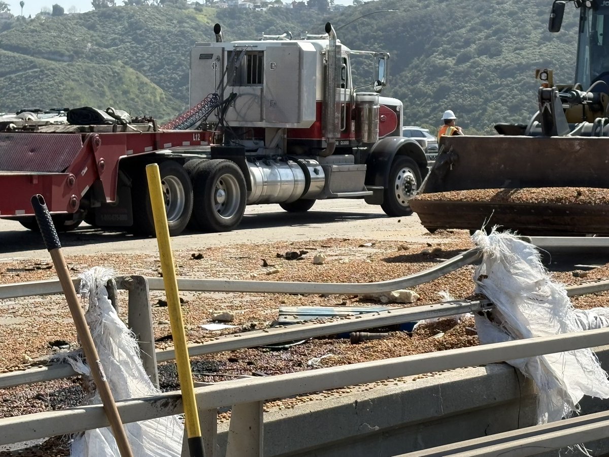 Three of four lanes of southbound 805 at the 8 remain closed as crews continue to work to clear debris from a traffic collision resulting in a big rid fire. CHP is funneling traffic through the number one lane. Please proceed through with caution.