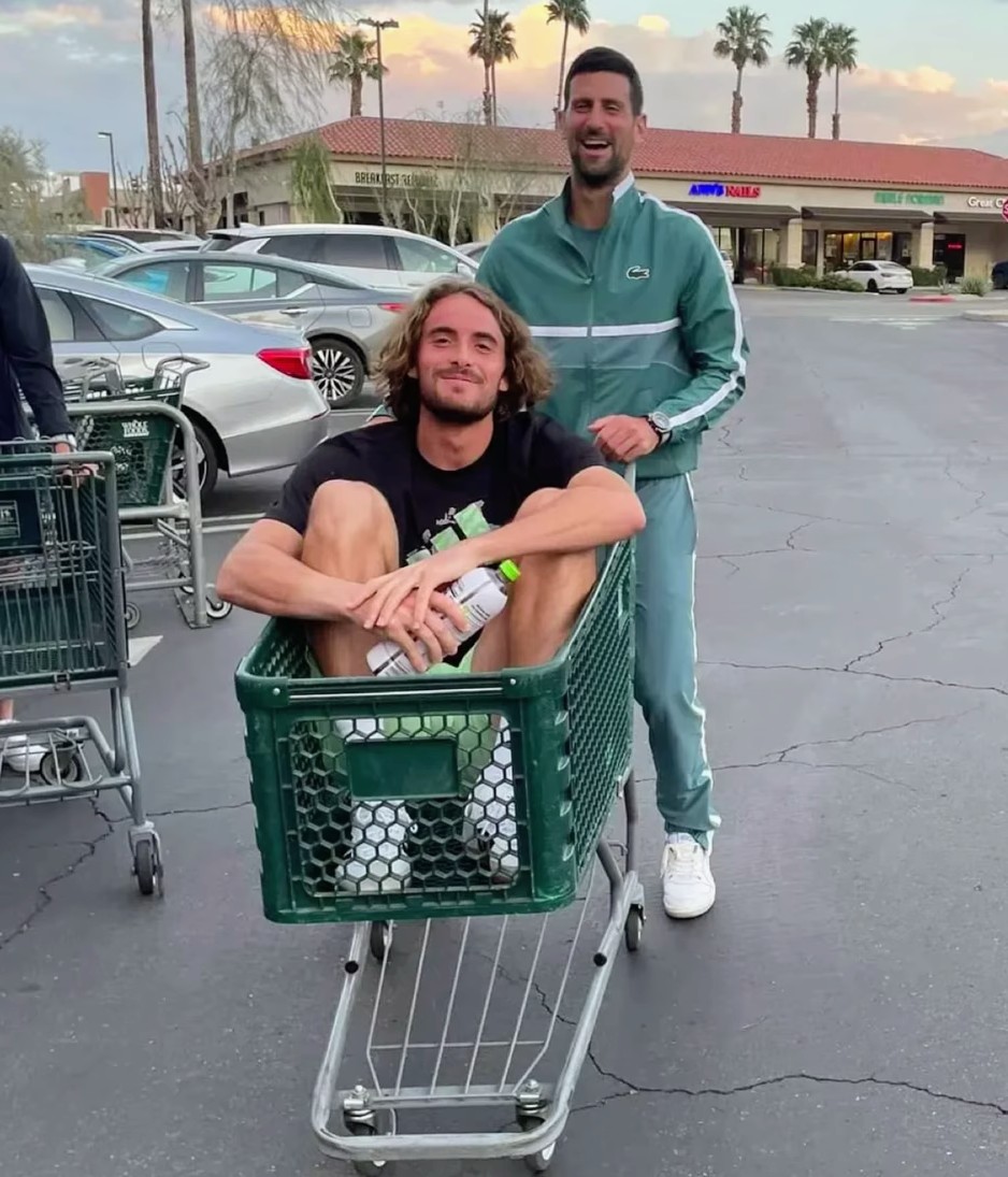 Imagine going grocery shopping and spotting Novak Djokovic pushing Tsitsipas around the parking lot in a cart. 🛒😭