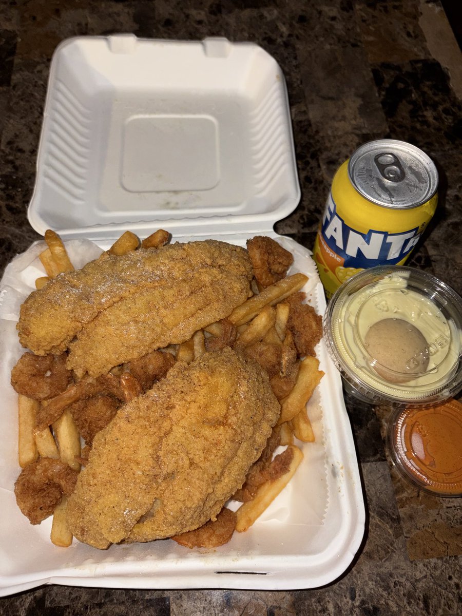Fish fillet, shrimp and fries eats with a side of banana pudding