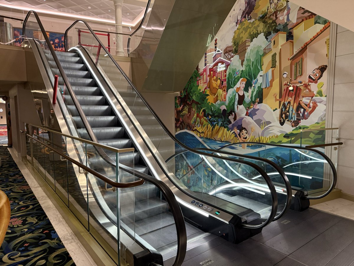 ScottGustin's tweet photo. A sight for sore legs. The Disney Adventure features escalators, a first for a Disney Cruise Line ship. https://t.co/YmL4liniot
