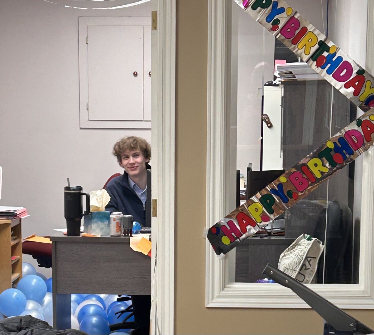 PurvisCulbert's tweet photo. We have a fun tradition in our office of surprising each other on birthdays. Yesterday was our chance to have some fun at Sam’s expense. There were a lot of balloons on the floor for him to wade through. Happy Bday Sam! https://t.co/i82D1QLP6I