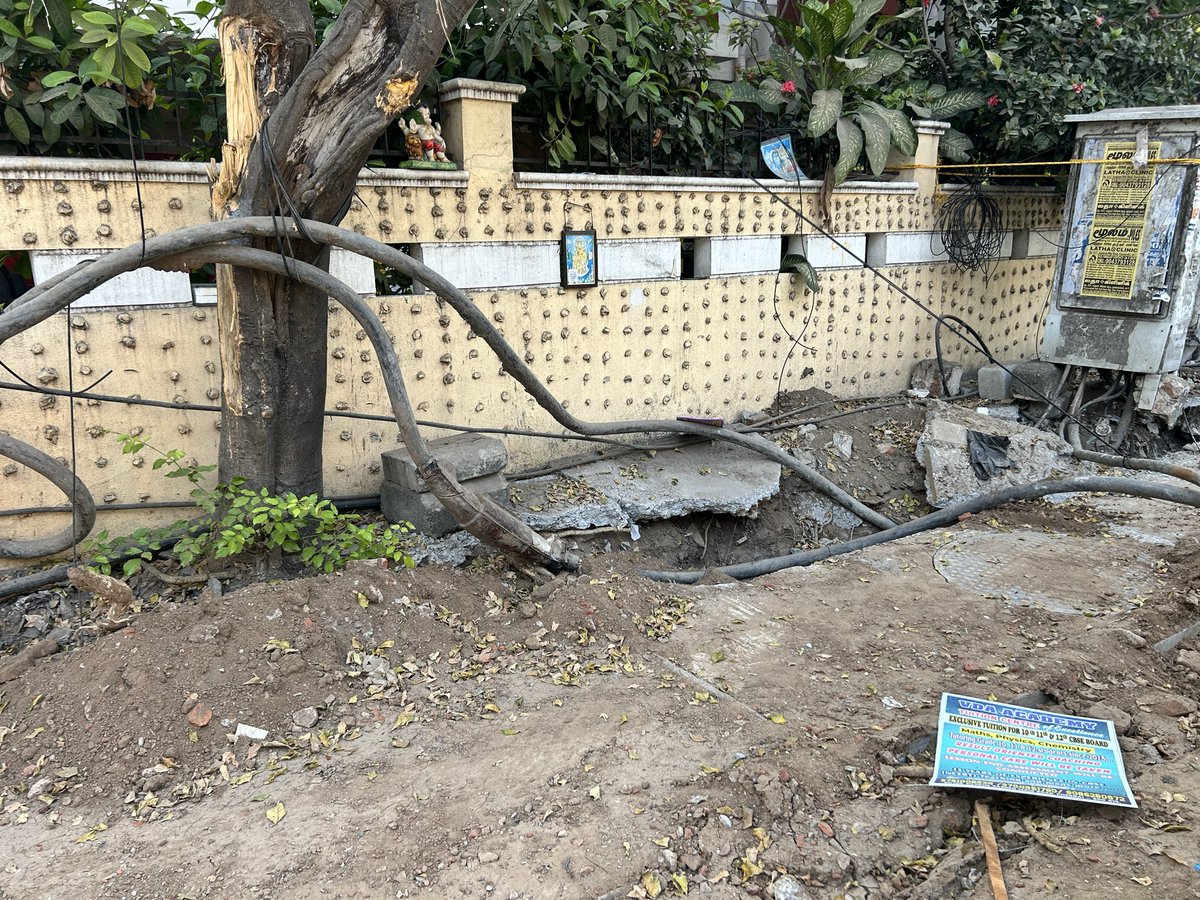 akrish1971's tweet photo. Recently storm water drain work was done at umayal Rd, Kilpauk. TNEB junction box is seen hanging precariously. The UG cable is tied up to a nearby tree. Even the post work clean up hasn’t been done properly. Request @chennaicorp to do the needful &amp; rectify this @TANGEDCO_Offcl https://t.co/f40DYcsTOC