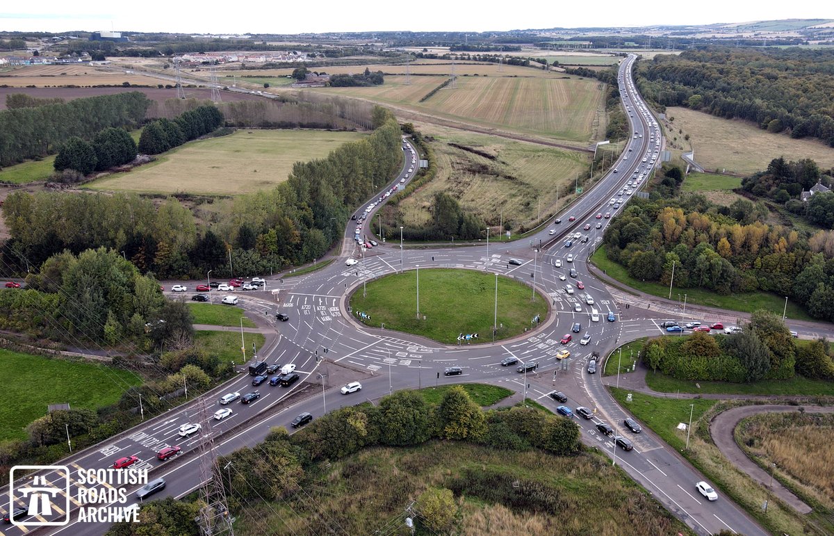 ScotRoadArchive's tweet image. It's #Friday13th today, considered unlucky by some!

Spare a thought for those unlucky drivers stuck in the traffic at Sheriffhall Roundabout in this recent drone photo.

It was completed in November 1988 as part of the Millerhill Section of the #Edinburgh City Bypass.

#archives