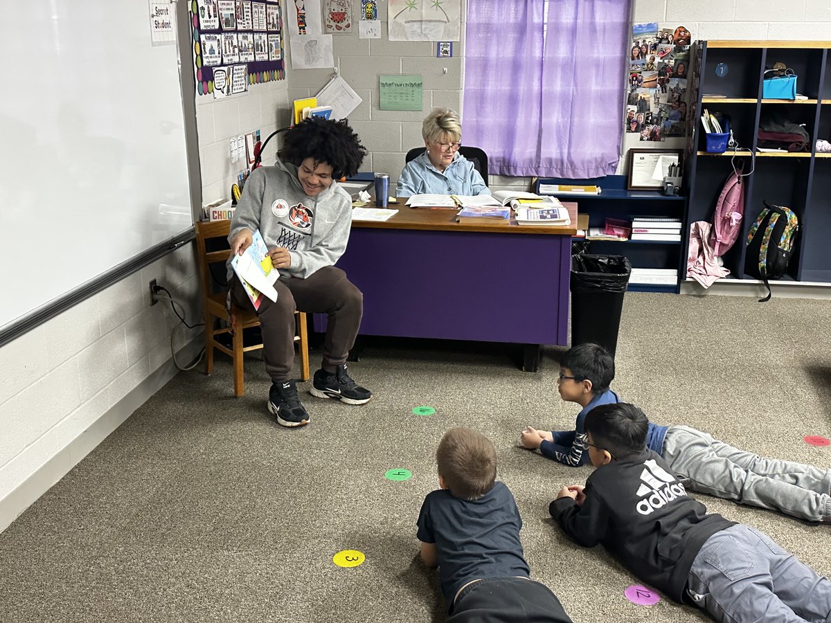 CowleyAthletics's tweet photo. Aven Mboule and members of the Tiger men’s basketball team read books to students at Roosevelt Elementary School on Wednesday. Bring a canned good and be admitted free to tonight’s home basketball games against Barton at 5:30 and 7:30. https://t.co/s76KkAFczd