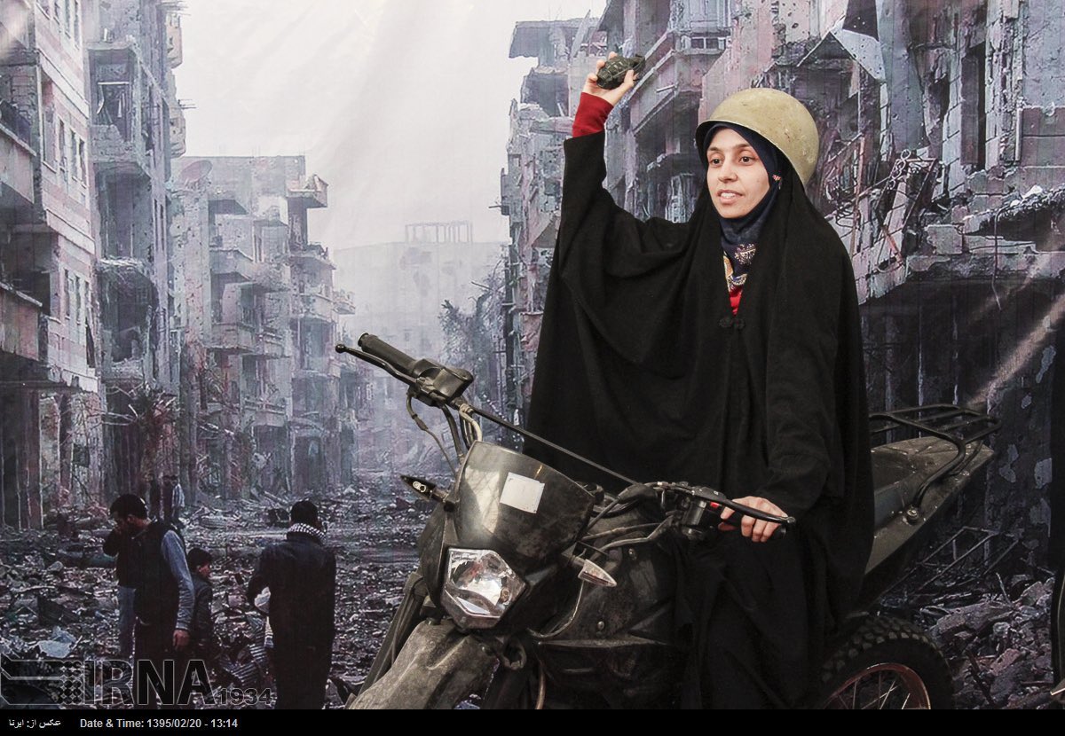 2016 - Tehran International Book Fair

Iranians taking photos with a destroyed Syrian city as the background that their government helped Assad destroy.