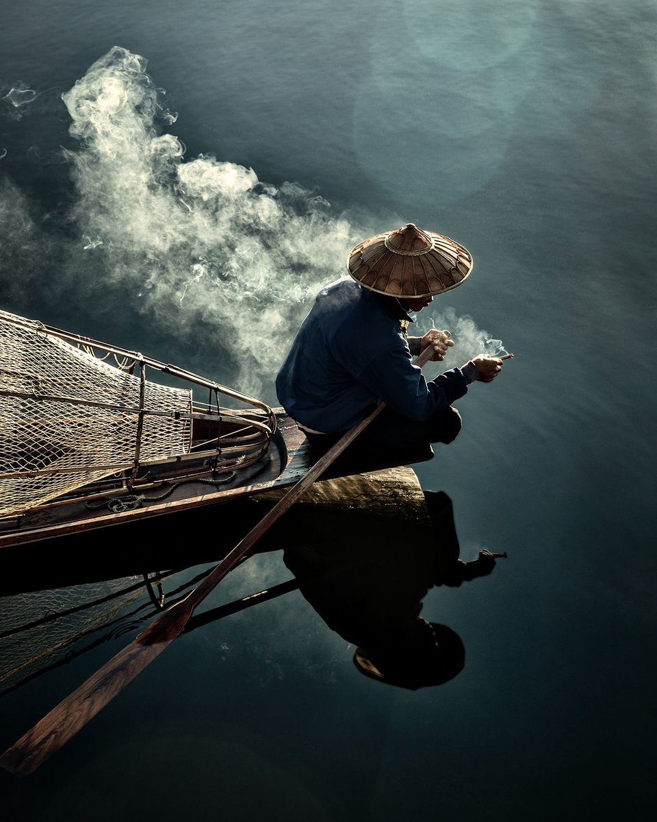 Reflections of a fisherman early in the morning. Inle Lake, Myanmar | Giovanna Aryafara