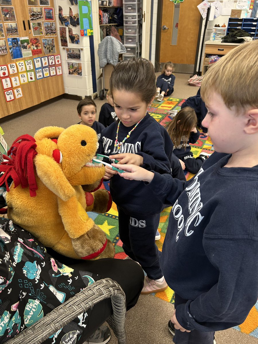 StDomSchool's tweet photo. PreK students had a special visit from dental hygienist, Ms. Vickie, who came to teach them all about dental health! She showed them how to take care of their teeth, the right way to brush, and why keeping smiles clean is so important. https://t.co/WVLmc8jf39